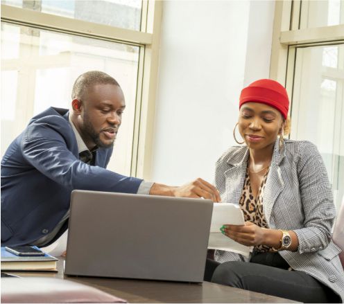 A Lomabil consultant going through loan options with a customer